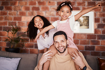 Image showing Portrait of happy family in home, parents and kid on sofa with piggy back, bonding and relax in lounge. Mom, dad and girl child on couch in apartment with playful man, woman and daughter together.