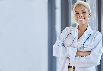 Image showing Woman, happy portrait and doctor with arms crossed in hospital for medical services, advice or mockup space in clinic. Surgeon, therapist and healthcare employee smile for pride, trust and consulting