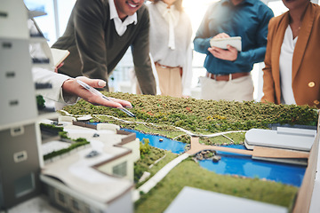 Image showing Creative people, hands and real estate with 3d model of building design, architecture or property at office. Closeup of group architect team in meeting, project planning or floor layout at workplace