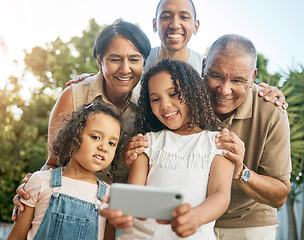 Image showing Grandparents, girl and garden selfie with family, outdoor and smile with dad, post and social network in summer. Senior man, woman and children with photography, profile picture or memory on web blog