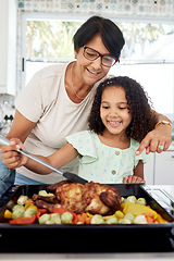 Image showing Kitchen, health and a grandmother cooking with her grandchild in their home together for thanksgiving. Children, love and a roast with a senior woman preparing a meal with a girl for food nutrition