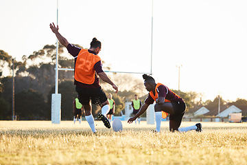 Image showing Rugby, kick and sport game with support, exercise and competition with athlete ball training. Field, back and target practice on grass with cardio, fitness and team workout outdoor for teamwork