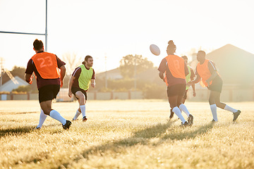 Image showing Rugby, training and men with ball to score goal on field at game, match or practice workout. Sports, fitness and player running to kick at poles on grass with energy and skills in team challenge.