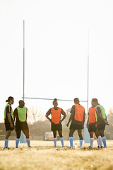 Image showing Rugby, training and men on field for motivation at game, match or practice workout together. Sports, fitness and team at poles on grass with energy, talent and inspiration for winning at challenge.