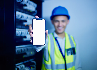 Image showing Phone, app and a man IT engineer in a server room for cyber security, maintenance or to install software. Mobile, display and information technology with a technician busy on a network database