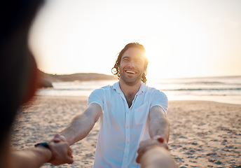 Image showing Man, holding hands and beach with pov, excited and happy for love, romance and freedom in sunset by ocean. People, together and comic laugh on sand, sea and waves for vacation, holiday or honeymoon