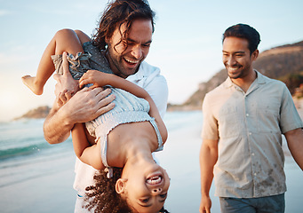 Image showing Beach, play and gay parents with girl on holiday, vacation and adventure in summer. Lgbtq family, healthy relationship and happy child with fathers by ocean for bonding, relaxing and fun outdoors