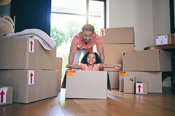 Image showing Father, child and box in new home for games, fun and freedom for bonding in real estate property. Happy dad, excited kid and portrait of girl play in cardboard boxes for race while moving to house