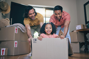 Image showing New home, girl and box with parents, push and gay dad with games, portrait and playing on floor with moving. LGBTQ men, female child and cardboard package for car, airplane or driving in family house