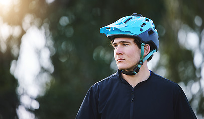 Image showing Thinking, nature and a man with a helmet for cycling, training for a triathlon or sports idea. Fitness, focus and a male cyclist or athlete with a vision for a marathon, travel or cardIo workout