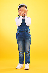 Image showing Fashion, portrait and hands on face of girl child in studio with deal, sale or giveaway on yellow background. Wow, emoji and mind blown kid winner with celebration for coming soon, surprise or prize