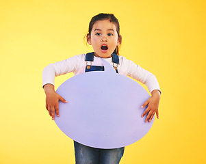 Image showing Girl child, thinking and speech bubble in studio with wow, news and mockup space by yellow background. Young female kid, poster or shock for promotion, review and opinion with vote for social media