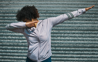 Image showing Dabbing, dance and a person on a city wall for hip hop, celebration or fitness. Urban, sports and a female athlete moving for workout, exercise success or training in a town for outdoor cardio