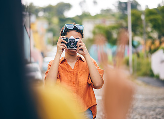 Image showing Photography, friends and women in city for travel on holiday, adventure and vacation on weekend. Camera, peace sign and female people take picture for social media, memories and bonding in town