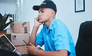 Image showing Safety, surveillance and a bored man security guard sitting at a desk in his office to serve and protect. CCTV, control and uniform with a tired officer working as a private government employee