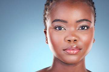 Image showing Black woman, beauty and portrait with cosmetics, makeup and dermatology treatment. Studio, model face and African female person with skincare, facial and blue background with skin glow and care