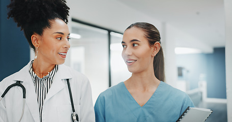 Image showing Women doctors, talking or walking in hospital in teamwork, nurse collaboration or surgery research. Smile, happy or healthcare workers in planning, communication or discussion for medicine treatment