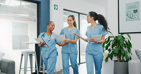 Image showing Talking nurses, walking and documents in hospital teamwork, diversity collaboration or bonding on surgery or clinic break. Smile, happy and healthcare women with medical research, paper or funny joke