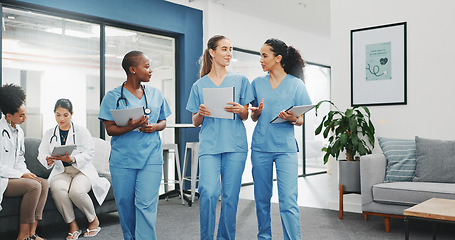 Image showing Talking nurses, walking and documents in hospital teamwork, diversity collaboration or bonding on surgery or clinic break. Smile, happy and healthcare women with medical research, paper or funny joke