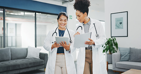 Image showing Talking doctors, walking or tablet in busy hospital, teamwork or collaboration for surgery planning, medicine or life insurance app. Smile, happy or planning healthcare women on technology research