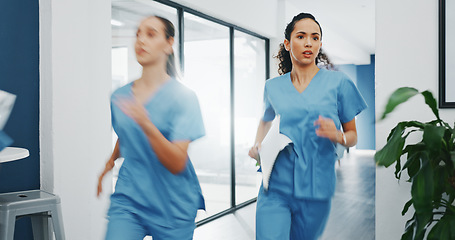 Image showing Doctors, nurses or running in hospital emergency, patient crisis or pager call in ICU stress, trauma fail or diversity clinic. Healthcare women, rushing or run in medical hallway to code blue problem