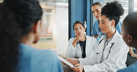 Image showing Doctors, nurse and women on clipboard in meeting, collaboration or teamwork for hospital planning, medical or life insurance. Talking, leadership and healthcare workers on paper in diversity research