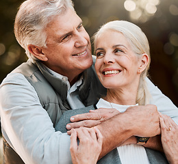 Image showing Happy, love and senior couple hug at a park, free and enjoy travel, holiday or weekend. Face, smile and elderly man embrace woman in forest, bond and having fun on retirement trip outdoor together