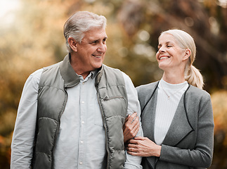 Image showing Happy, love and peace with old couple in nature for bonding, relax and support. Smile, happiness and retirement with senior man and woman walking in countryside park for vacation and commitment