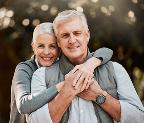 Image showing Happy, portrait and senior couple hug at a park, free and enjoy travel, holiday or weekend outdoor. Face, smile and elderly woman embrace man in forest, bond or having fun on retirement trip together