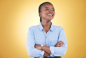 Image showing Thinking, smile and happy black woman confident arms crossed isolated in a studio yellow background. African, fashion and relax young person proud of style with a memory of joy, humor and fun