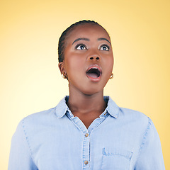 Image showing Thinking, wow and black woman with surprise, announcement and girl on a yellow studio background. Person, omg and model with expression, shocked and winner with giveaway, news and discount deal