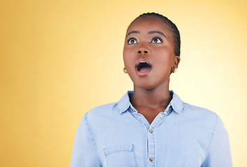 Image showing Surprise, wow or face of black woman in studio on yellow background amazed by retail discount deal. Wtf, omg or mind blown person shocked by sale offer, promotion or news announcement with mouth open