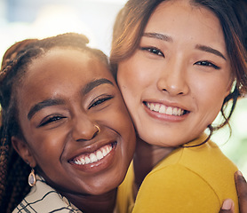 Image showing Face, happy and lesbian couple hug in home, bonding and having fun together. Portrait smile, gay and women embrace in love, care or respect, trust and support in commitment, loyalty and interracial