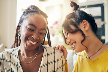 Image showing Happy, laugh and friends gossip, speaking and bond with joke, humor and story in their home. Smile, funny and women with diversity in a living room share drama, chat and silly, talk and enjoy weekend