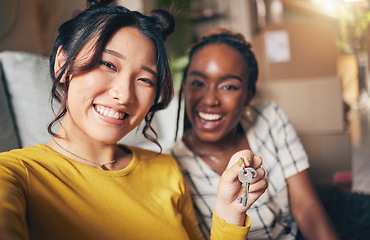 Image showing Couple of friends, keys and new home selfie for moving in together for real estate investment. Rent, mortgage and loan of women with smile for social media portrait at apartment or house with partner