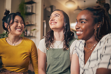 Image showing Happy, friends and women in a living room with funny, conversation and bond in their home together. Gossip, smile and people with diversity in a house for reunion, weekend and relax on day off