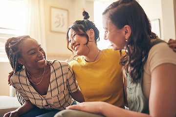 Image showing Happy, hug and women friends gossip, speaking and bond with care, trust and story in their home. Smile, embrace and people with diversity in a living room with support, conversation and social visit