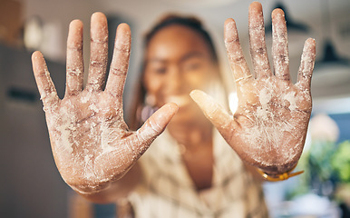 Image showing Hands, flour and baking by woman in a kitchen for bread, pizza or handmade food at home. Wheat, palm and female chef with messy fingers from cooking, fun and preparing diy, pasta or cake in her house