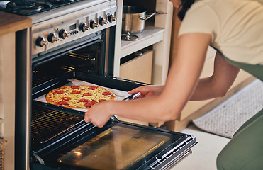 Image showing Hands, open oven and pizza baker for food, restaurant and fast food with skill in home kitchen for baker in Naples. Chef woman, dough and pepperoni pie for cuisine, culture and preparation process