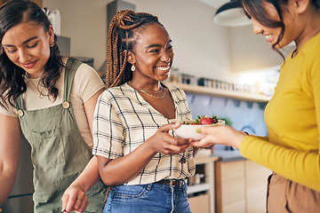 Image showing Women, friends and eating fruit in home for bonding, nutrition and happy lunch together. Healthy diet, sharing and wellness, fresh summer food for friendship and girls in kitchen with smile at party.