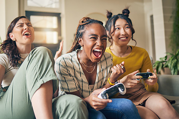 Image showing Friends, women and gaming on tv, winner in home living room on sofa and smile, relax and bonding. Television, girls and celebration on video game success on couch, esports competition and excited