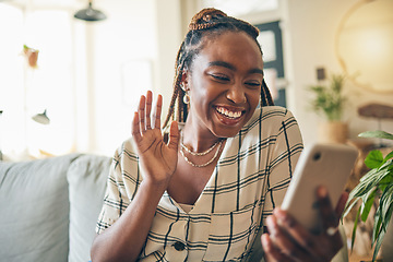 Image showing Wave, phone and black woman on video call in home, communication and conversation. Smartphone, hello and happy person in webinar, virtual chat or online meeting, welcome and greeting on sofa in house