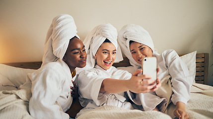 Image showing Spa day, selfie and friends in bed relax with social media during skincare routine at home. Bedroom, self care and women beauty influencer with smartphone smile for profile picture, blog or podcast