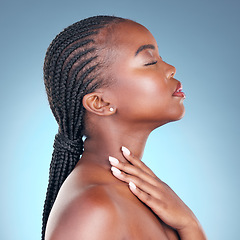 Image showing Skin care, beauty and face of black woman with dermatology, makeup and manicure. Profile of African person on blue background with cosmetics, shine and facial glow with hand for soft touch in studio