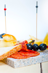 Image showing mix cold cut on a stone with fresh pears