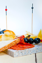 Image showing mix cold cut on a stone with fresh pears