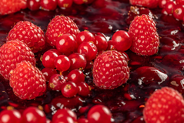 Image showing Raspberry jelly lies on cake