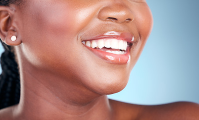 Image showing Woman, teeth and smile in dental cleaning, hygiene or treatment against a blue studio background. Closeup of female person mouth in tooth whitening, oral or gum healthcare for healthy wellness