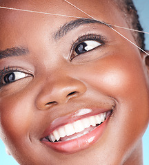 Image showing Thread, eyebrow plucking and beauty of a woman with dermatology, natural makeup and smile. Face of an African person on a studio background with cosmetics, hair removal and facial glow or self care