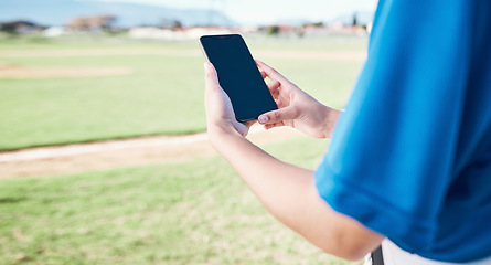 Image showing App, field and person with a phone for baseball information, reading score or results after a game. Fitness, hands and an athlete with a mobile for training, connection or streaming a contest